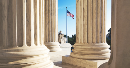Image of columns with American flag, representing U.S. government collaborations