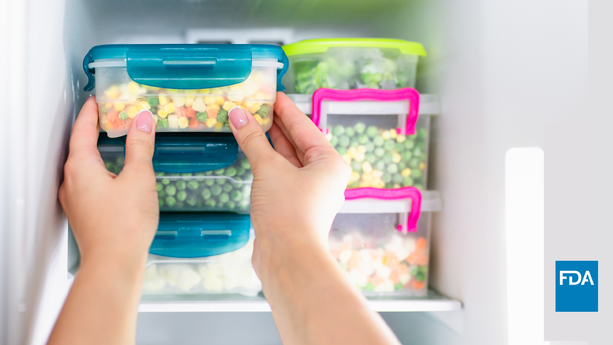 Person puts leftover food in storage container into freezer