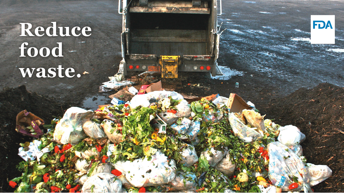 Garbage truck dumps food and trash at landfill dump
