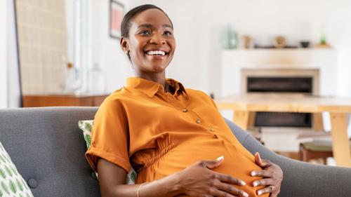 Image of smiling black pregnant woman