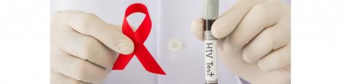 hands holding AIDS Ribbon and test tube labeled HIV Test