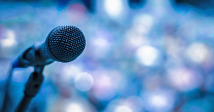 photo of a microphone against a blurry background