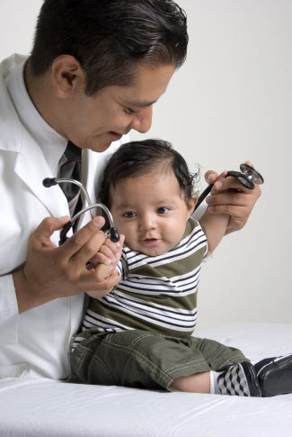 Doctor playing with baby