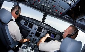 pilots in large jet cockpit (350 x 215)