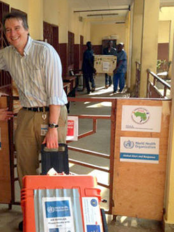 Professor Miles Carroll arrives at an EVIDENT facility in Guinea with research equipment (Image: EVIDENT)