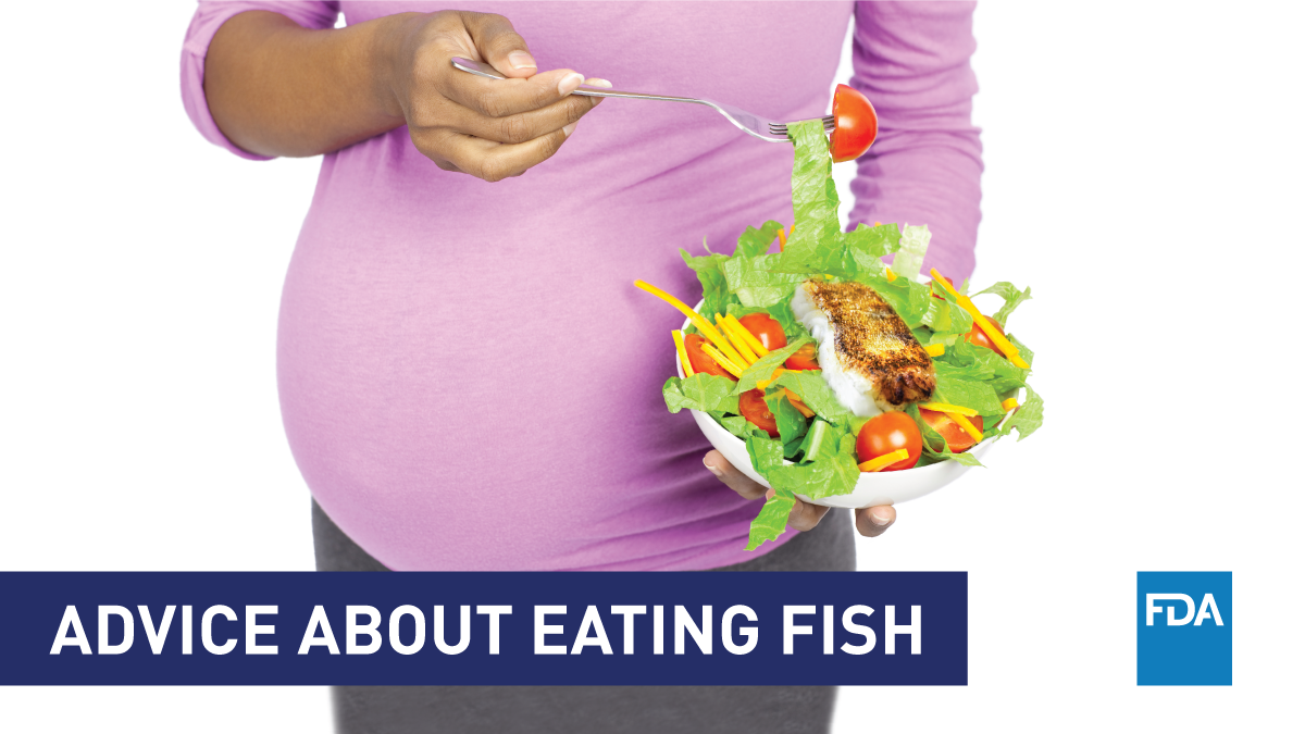 Advice About Eating Fish (pregnant woman eating fish and salad)