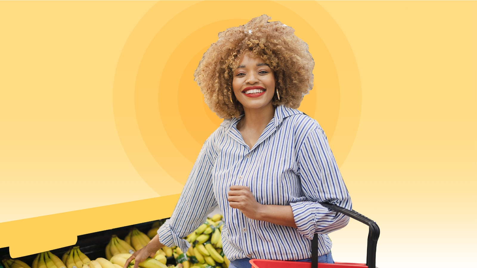 Young African American woman shopping for bananas at grocery store.