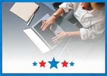 a person typing at a laptop