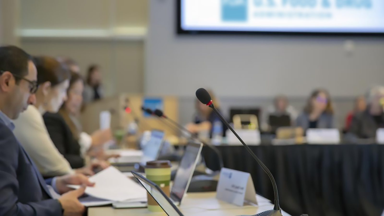People sitting in a conference room.