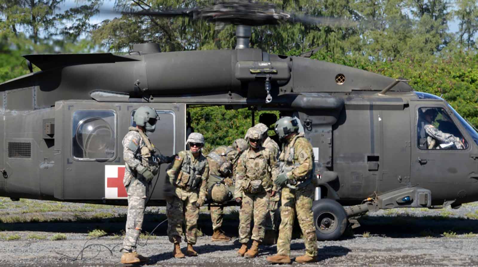 Combat medics conduct an exercise at the Marine Corps Training Area Bellows, Hawaii, on Jan. 10, 2018. (U.S. Army photo by Staff Sgt. Armando R. Limon, 3rd Brigade Combat Team, 25th Infantry Division)