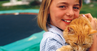 girl holding a cat