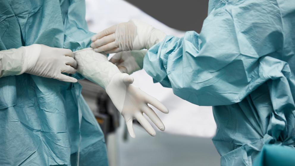 Doctors with latex gloves