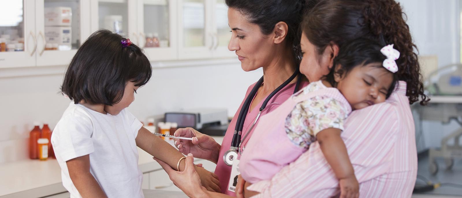 Young child receiving vaccine