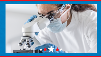 A person wearing a white lab coat and gloves and a white lab coat