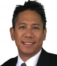 Photo of a man smiling at the camera