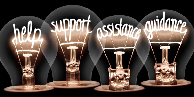Lightbulbs with the filaments spelled out to the words "help", "support", "assistance", "guidance"