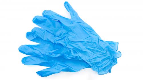 pair of blue medical gloves - medical gloves for COVID-19.