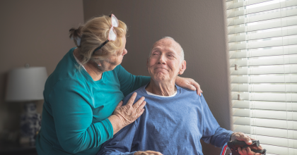 Older man is comforted by wife