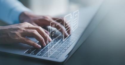 decorative image of a person typing on a keyboard