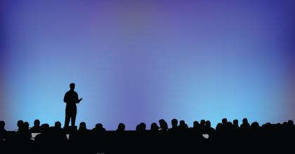 Person addressing a large audience