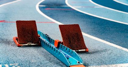 Blue racetrack with starting blocks 