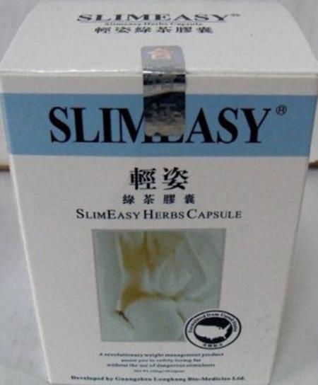 SlimEasy Herbs capsules packed in blister packaging and placed in a white box with black labeling.