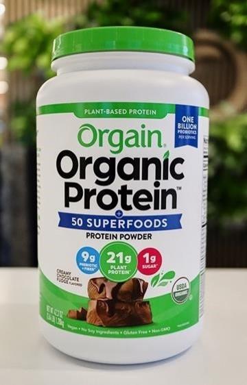 Image 1 “Front label, Orgain Organic Protein Powder + Superfoods, Creamy Chocolate Fudge, 43.8 oz container”