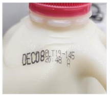 Location of printed date code and plant code on Prairie Farms milk handle