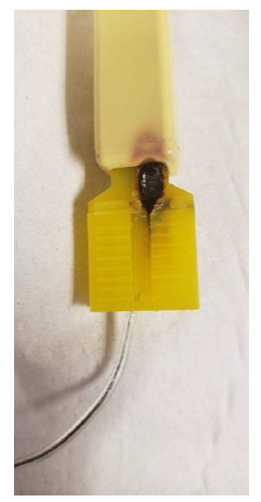 Photo depicting defect showing signs of localized thermal damage