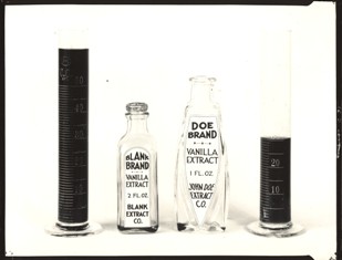 A flask on the right, two cans in the middle and another flask on the right. Flasks contain liquid