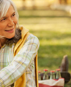 Older woman smiling outdoors