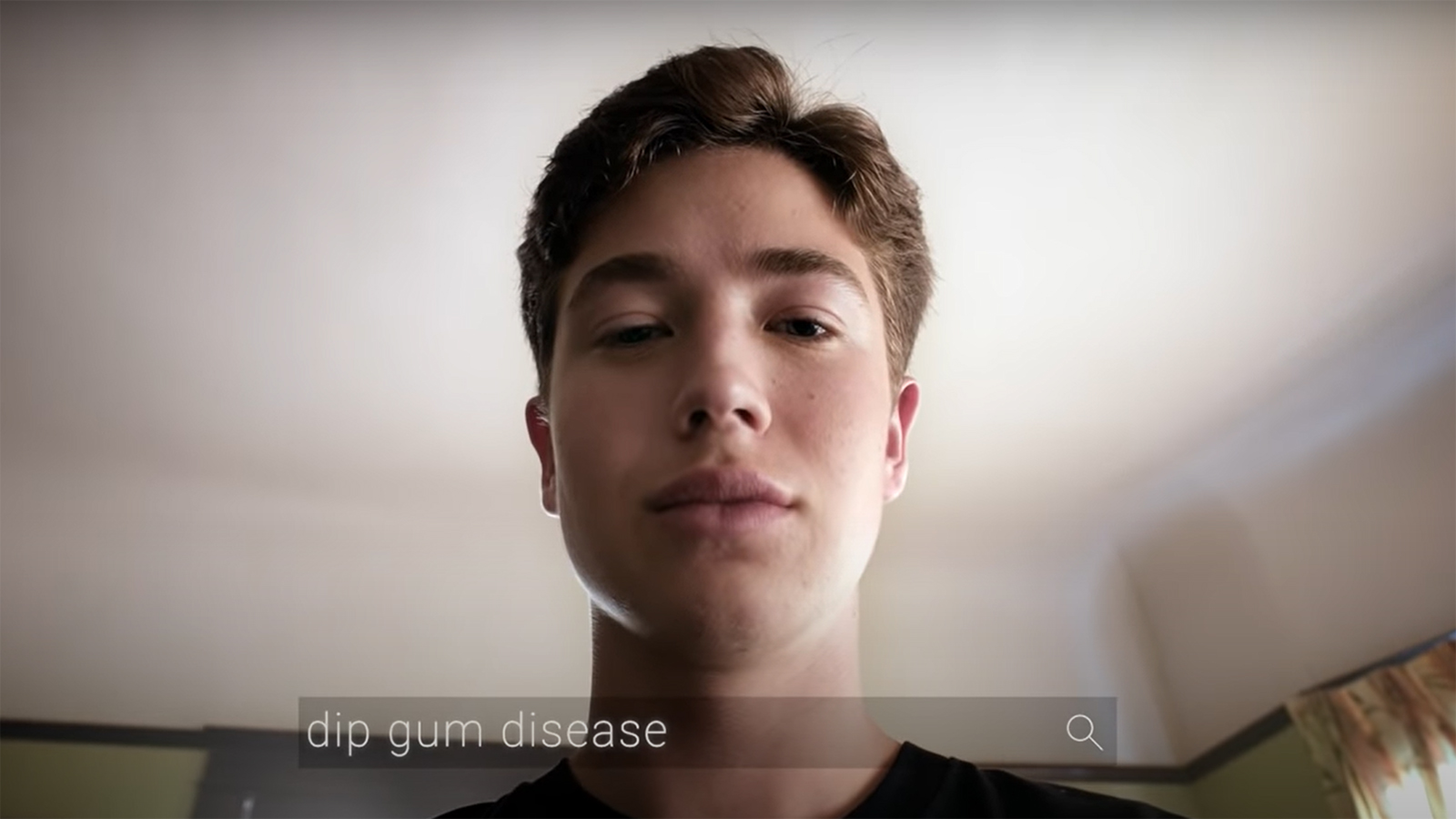 Boy searching the term "gum disease" online