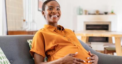 Image of smiling black pregnant woman