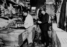 Baltimore Inspector Earnshaw inspects a dirty egg packing facility circa 1912. (v2)